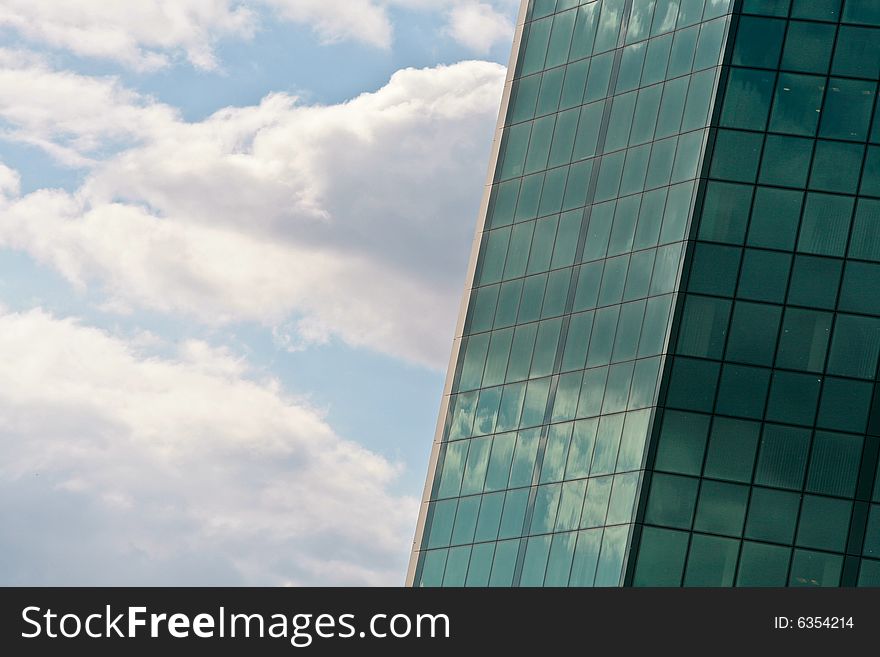 Architecture series: modern city business building and clouds