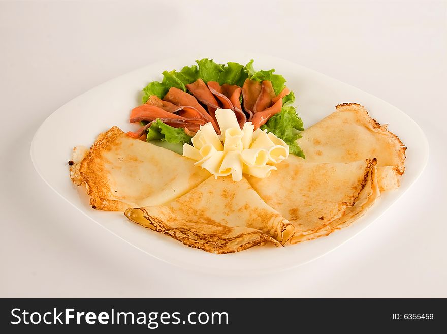 Salad with pancakes isolated, clipping path included. Salad with pancakes isolated, clipping path included