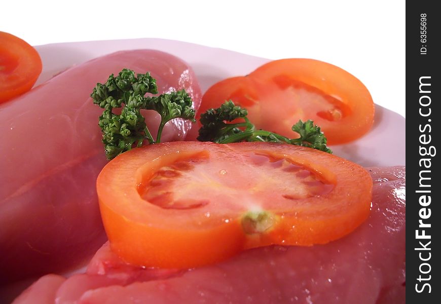 Plate with tomato and red meat. Plate with tomato and red meat