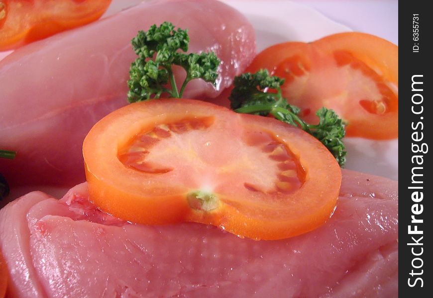 Plate with tomato and red meat. Plate with tomato and red meat