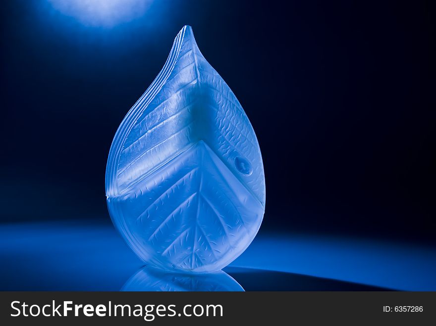 Perfume bottle in blue light