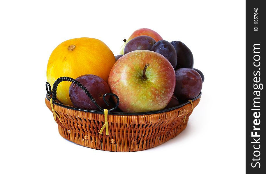 Basket with fruits isolated on a white background