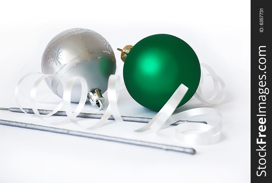 Christmas spheres and sparks on a white background