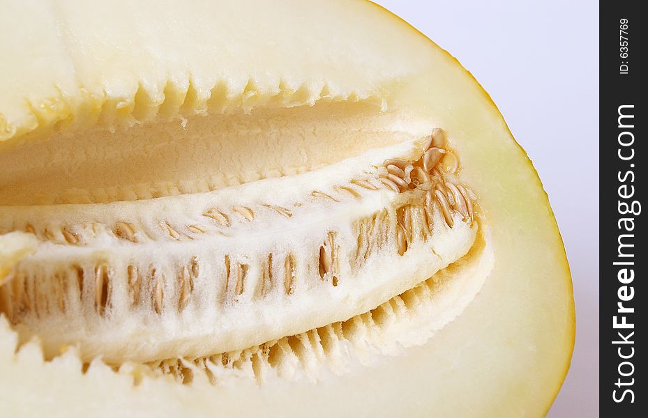 Half of ripe juicy melon. A closeup. Half of ripe juicy melon. A closeup