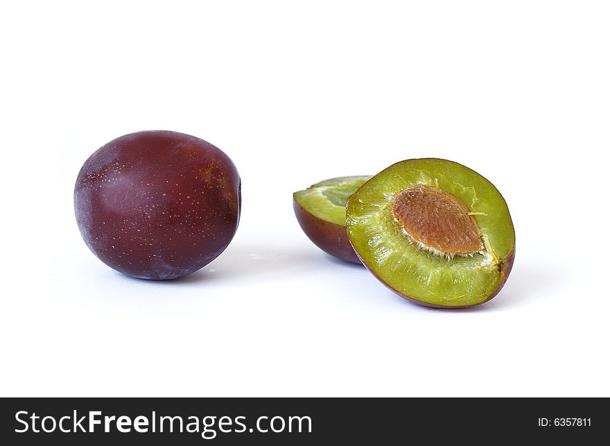 Ripe plums isolated on a white background