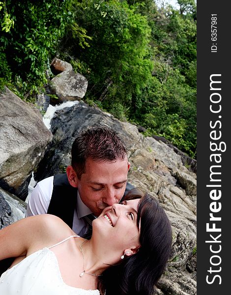 Happy bride and groom kissing on their wedding day.