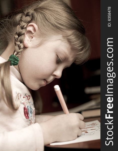 An image of little girl with pencil. An image of little girl with pencil