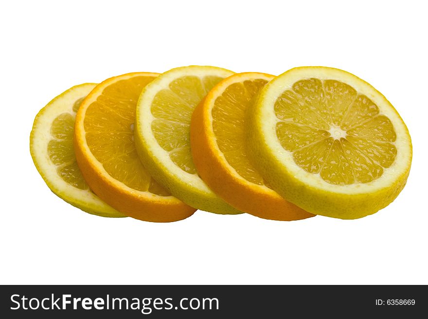 Orange and lemon cut by round pieces on a white background