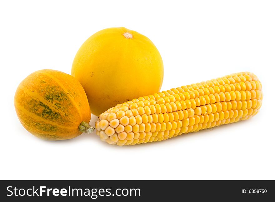 Corn with a yellow pumpkin