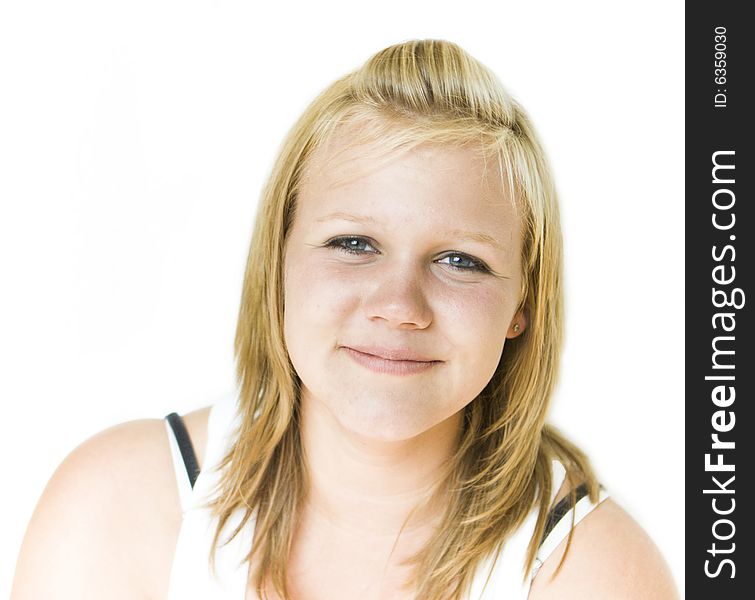 Young teenage girl looking happily into camera. Isolated on white background. Young teenage girl looking happily into camera. Isolated on white background