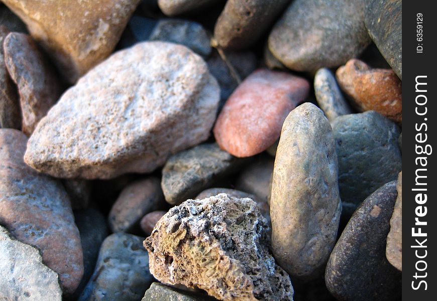 The multi-coloured stones photographed close up. The multi-coloured stones photographed close up