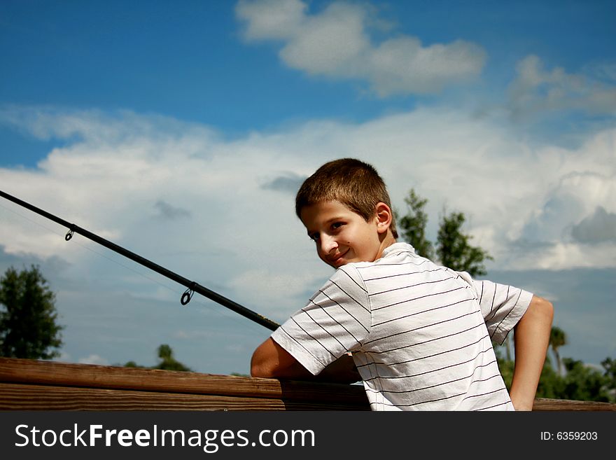 Boy fishing on a pond