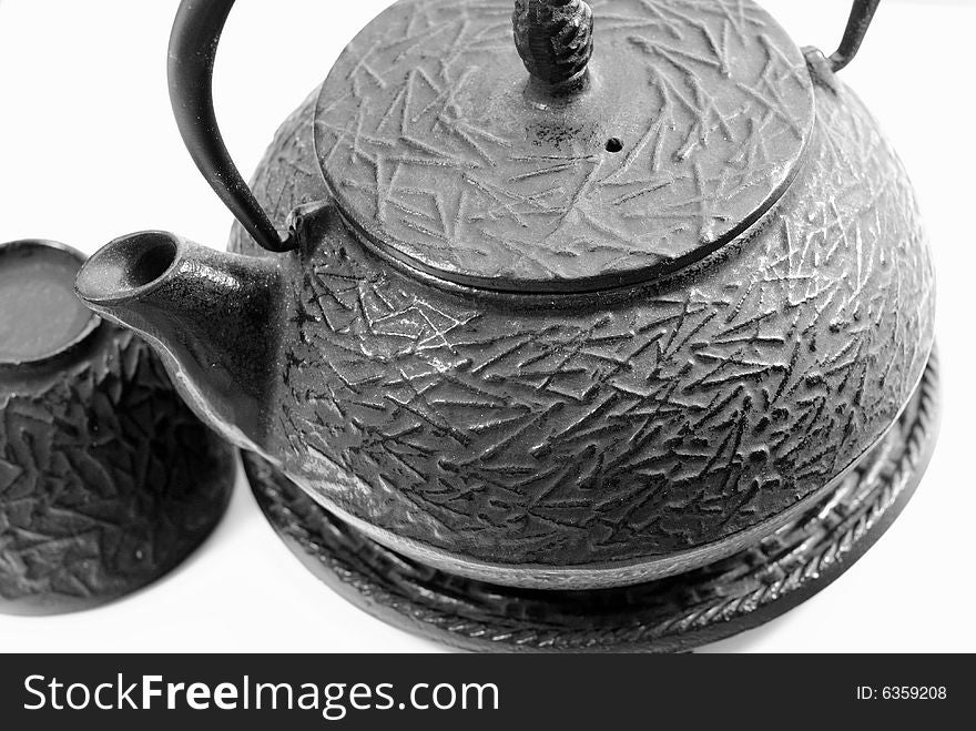 This is a shot of a Chinese tea pot and cup.