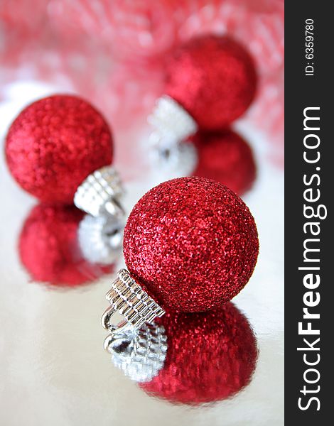 Beautiful red Christmas ornaments with reflection. Beautiful red Christmas ornaments with reflection.