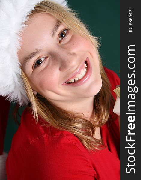 Christmas teen wearing a red hat with a big smile