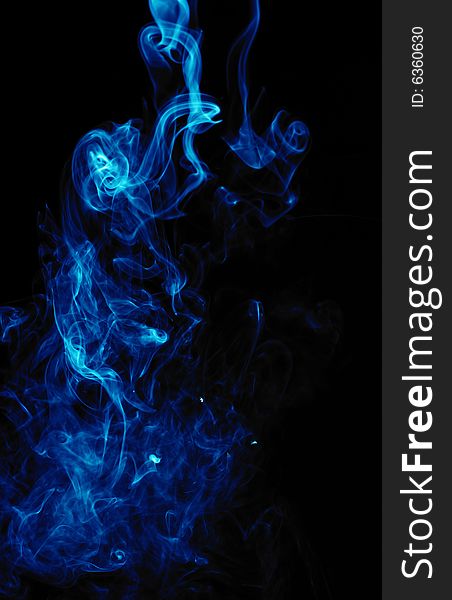 Blue smoke on black background