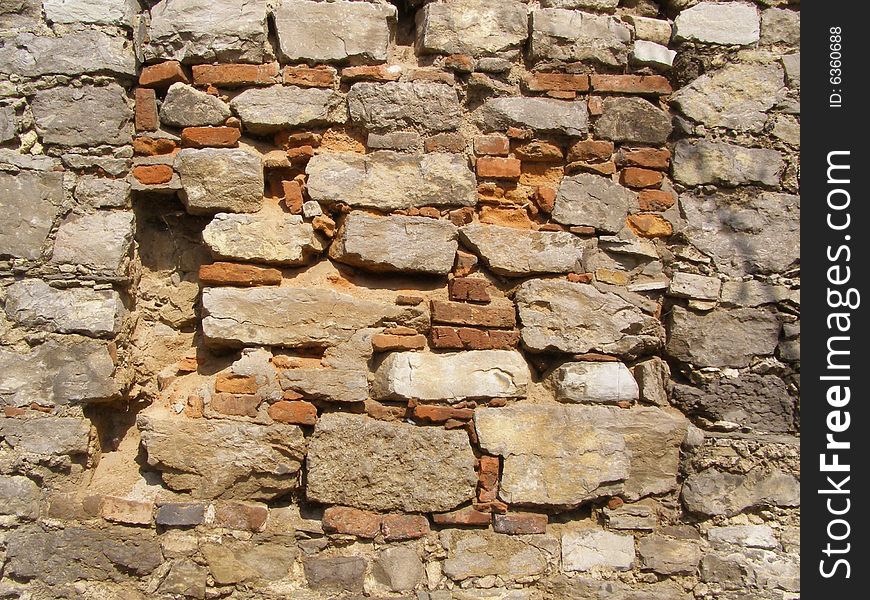 An old shabby brick wall. An old shabby brick wall
