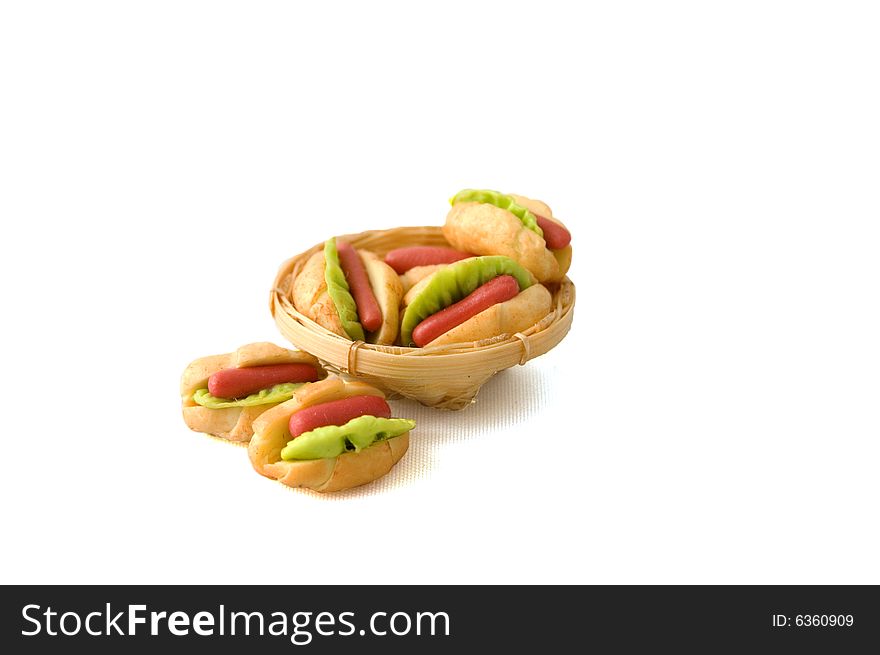 Couple of hotdogs in a backet isolated on white