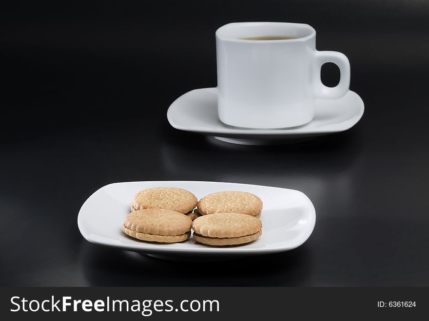 Cookies and coffee in a black back