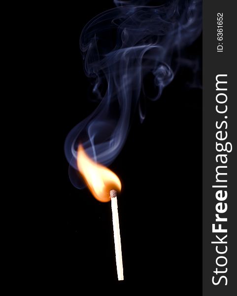 Match fire smoke on black background