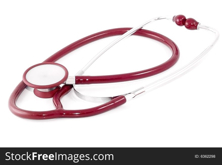 A red clinical stethoscope on the white background