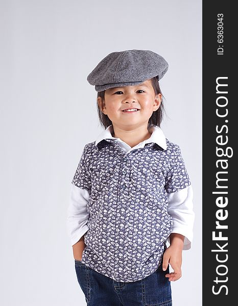 Little asian girl with a hat