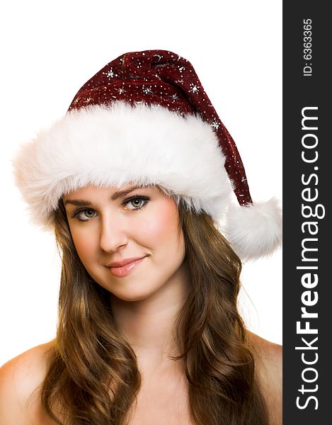 Isolated portrait of a beautiful young smiling woman with a christmas cap. Isolated portrait of a beautiful young smiling woman with a christmas cap