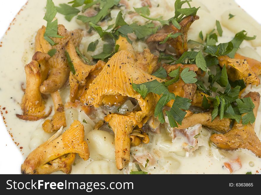 Chanterelles and gnocchi pasta on a plate