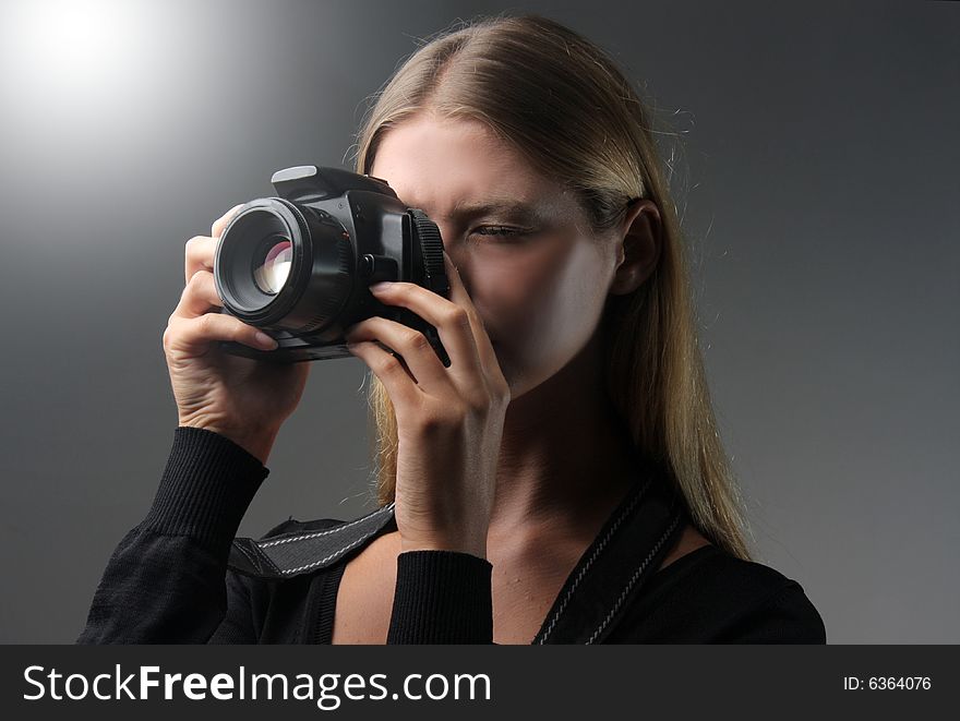 A girl with photo camera