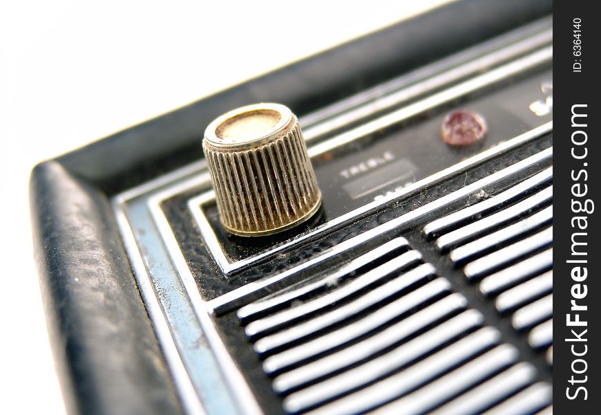 Metal tuning knob on antique transistor radio