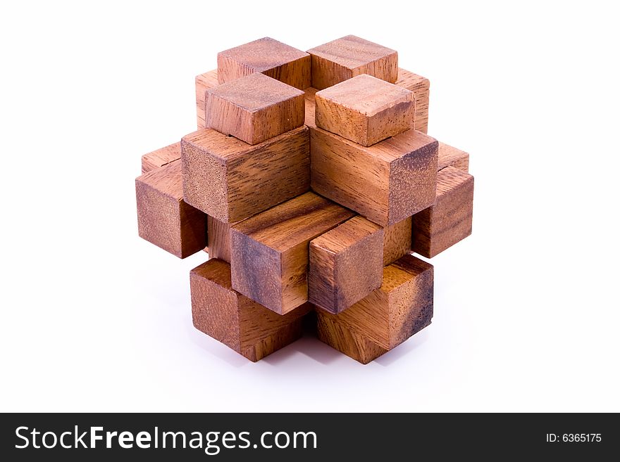 Assembled 24 piece burr puzzle in wood on white background