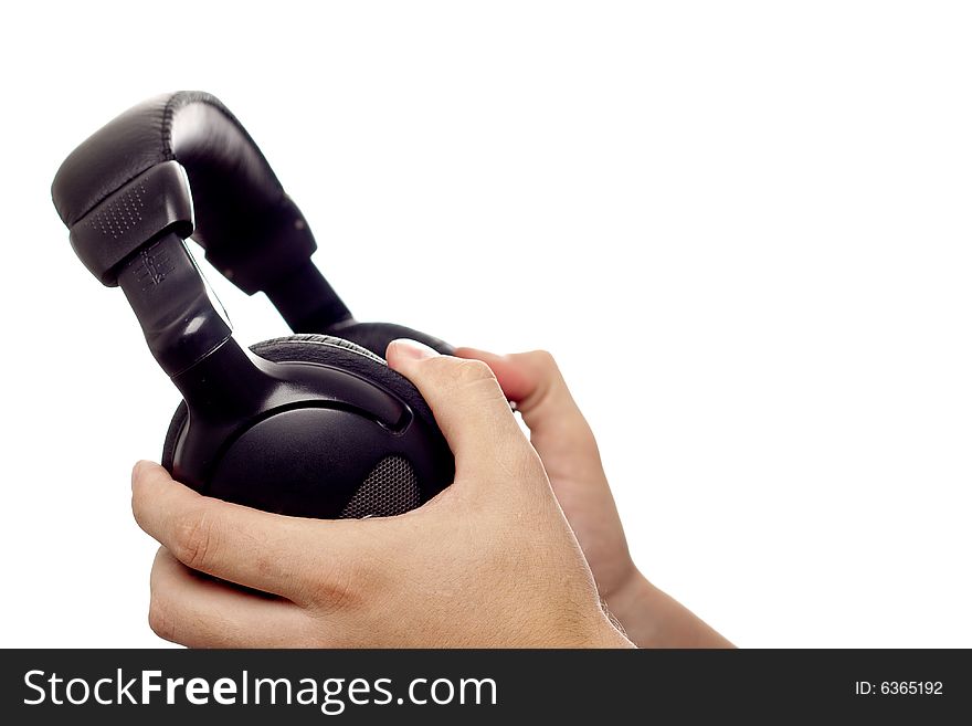 Black headphones in man hands, copy space for the text. Black headphones in man hands, copy space for the text