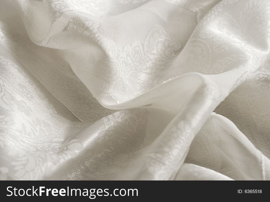 Offwhite satin fabric backdrop with plenty of room for text. Offwhite satin fabric backdrop with plenty of room for text