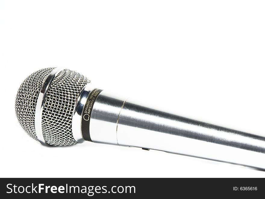 Silver and black microphone on white background