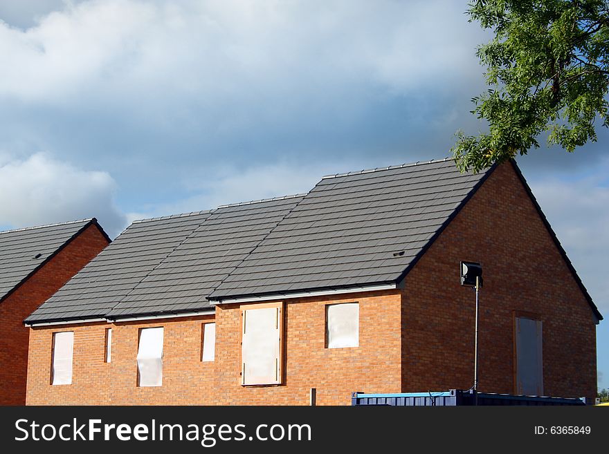 Newly built modern houses in summer. Newly built modern houses in summer