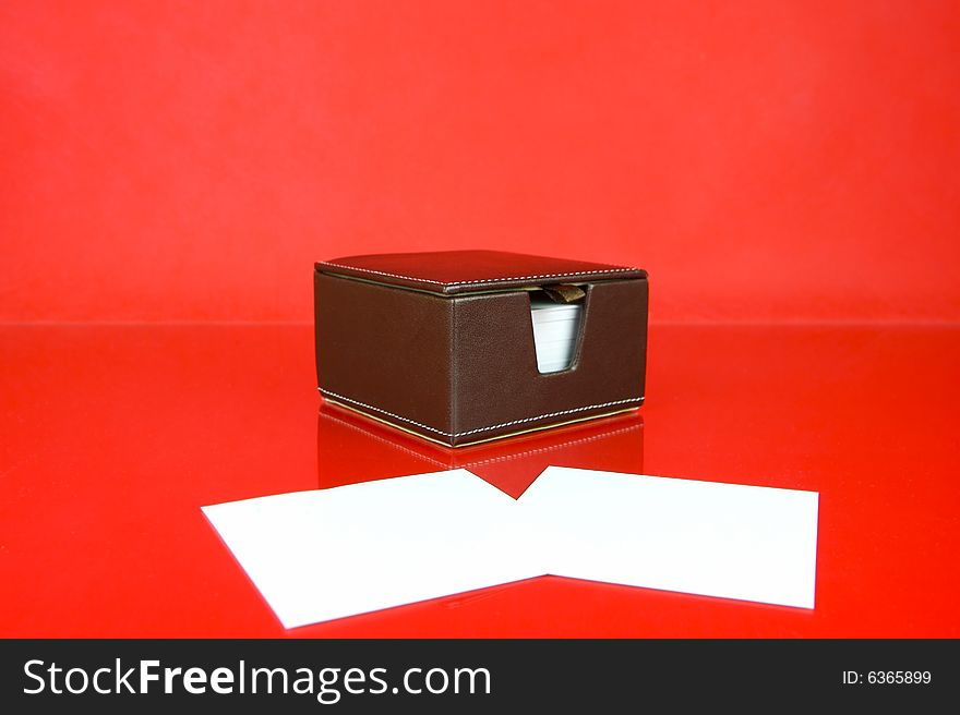 A note block isolated against a red background. A note block isolated against a red background