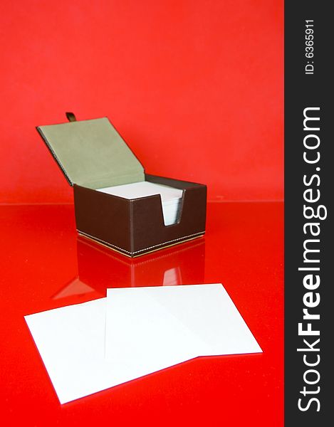 A note block isolated against a red background. A note block isolated against a red background