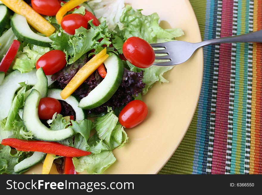 Fresh colorful salad with cherrie tamatoes and cucumber. Fresh colorful salad with cherrie tamatoes and cucumber