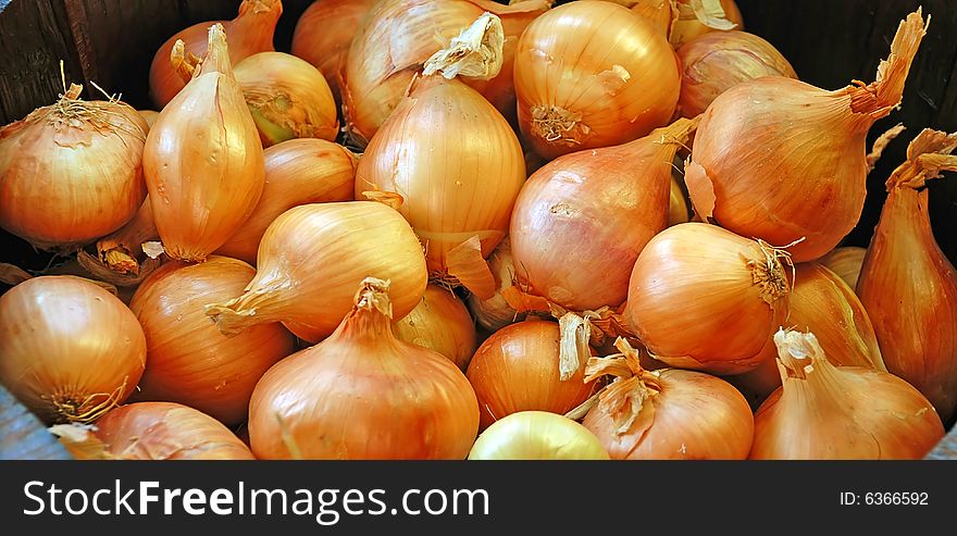 Orange large onion bulbs food background. Orange large onion bulbs food background