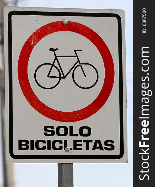 An 'only bicycles' sign in Spanish. An 'only bicycles' sign in Spanish