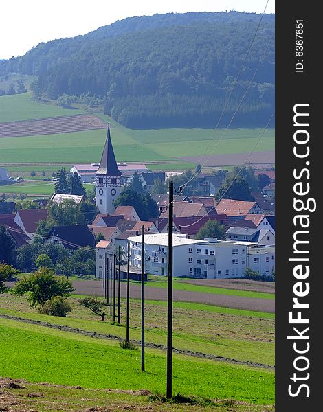 A typical village of south western Germany with leading telephone poles in the foreground