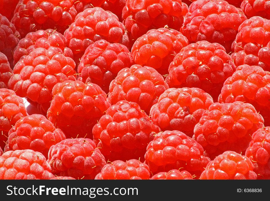 Close up of the fresh ripe raspberry for the background. Close up of the fresh ripe raspberry for the background.