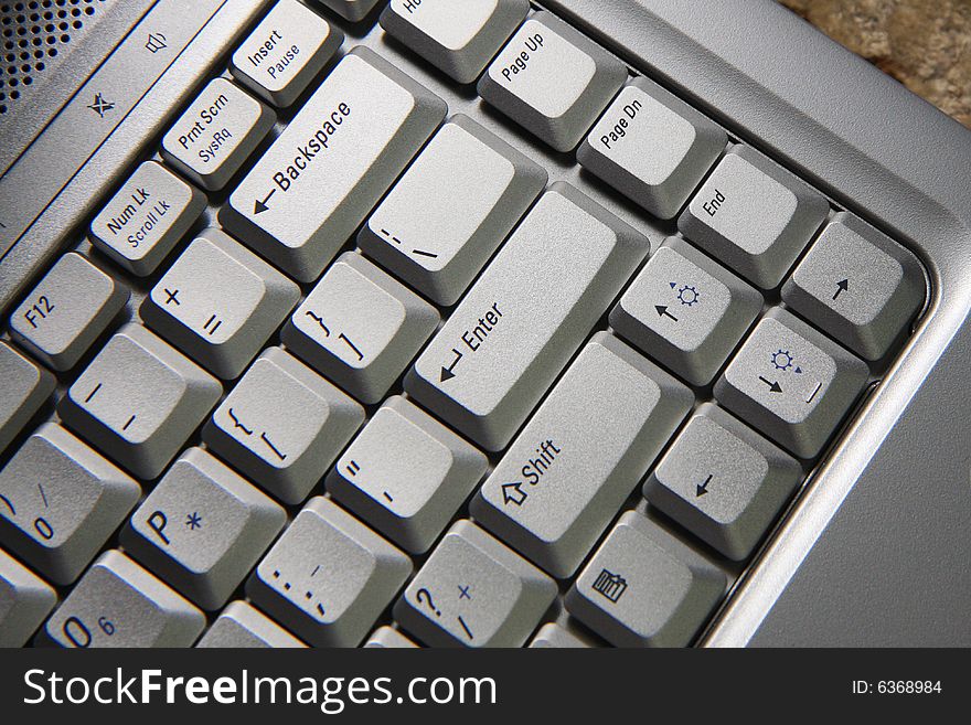 Silver laptop keyboard on the desk