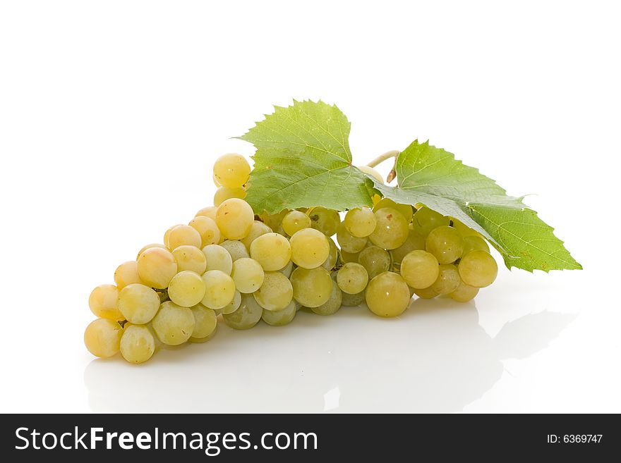 Bunch of fresh grapes on white background