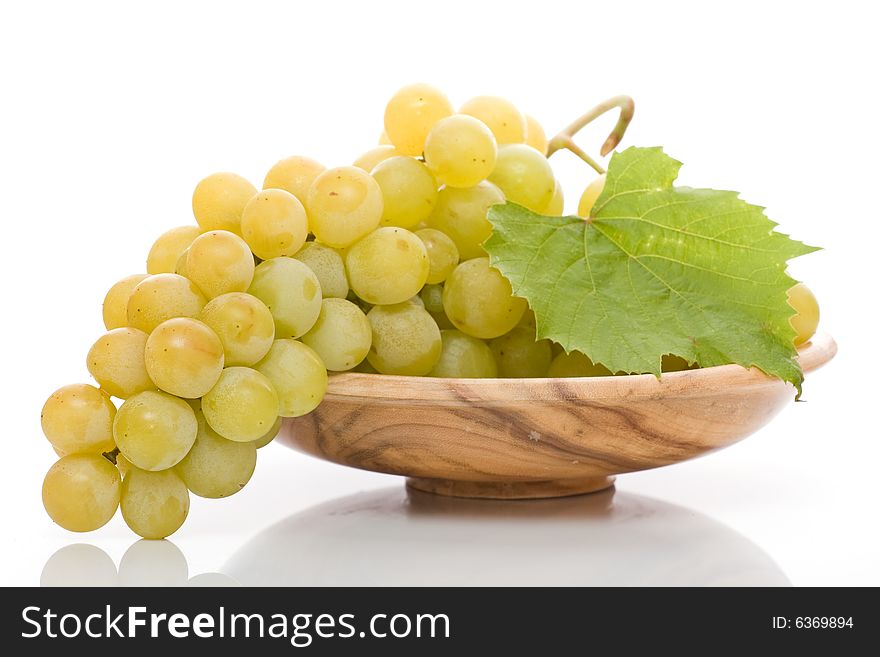 Bunch of fresh grapes on white background