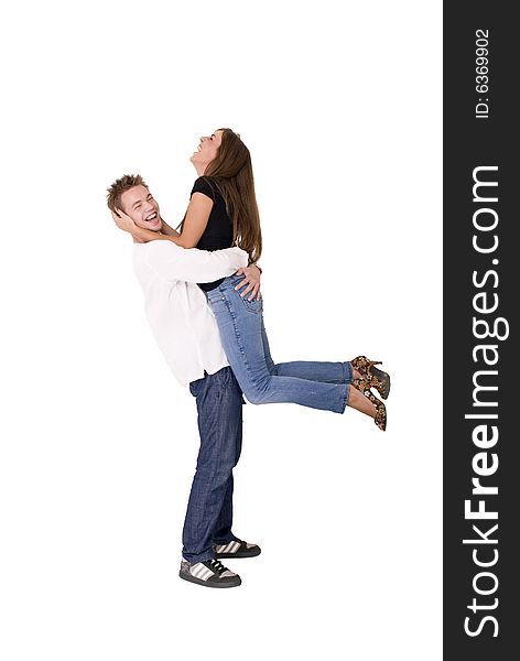 Boy is holding his girlfriend in the air. Boy is holding his girlfriend in the air