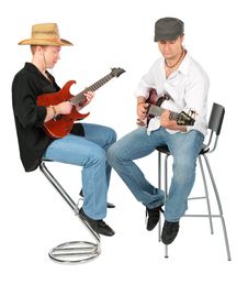 Two Sitting Men In Hats Play On Guitars Stock Image Two Sitting Men In Hats Play On Guitars Stock Image