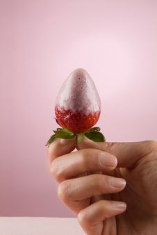 Holding A Strawberry Stock Images