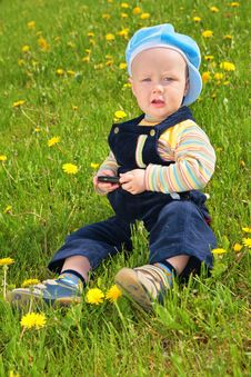 Child Sits On Grass Royalty Free Stock Images Child Sits On Grass Royalty Free Stock Images