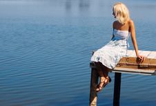 Girl Sitting On A Pier At The River Bank Stock Photos Girl Sitting On A Pier At The River Bank Stock Photos